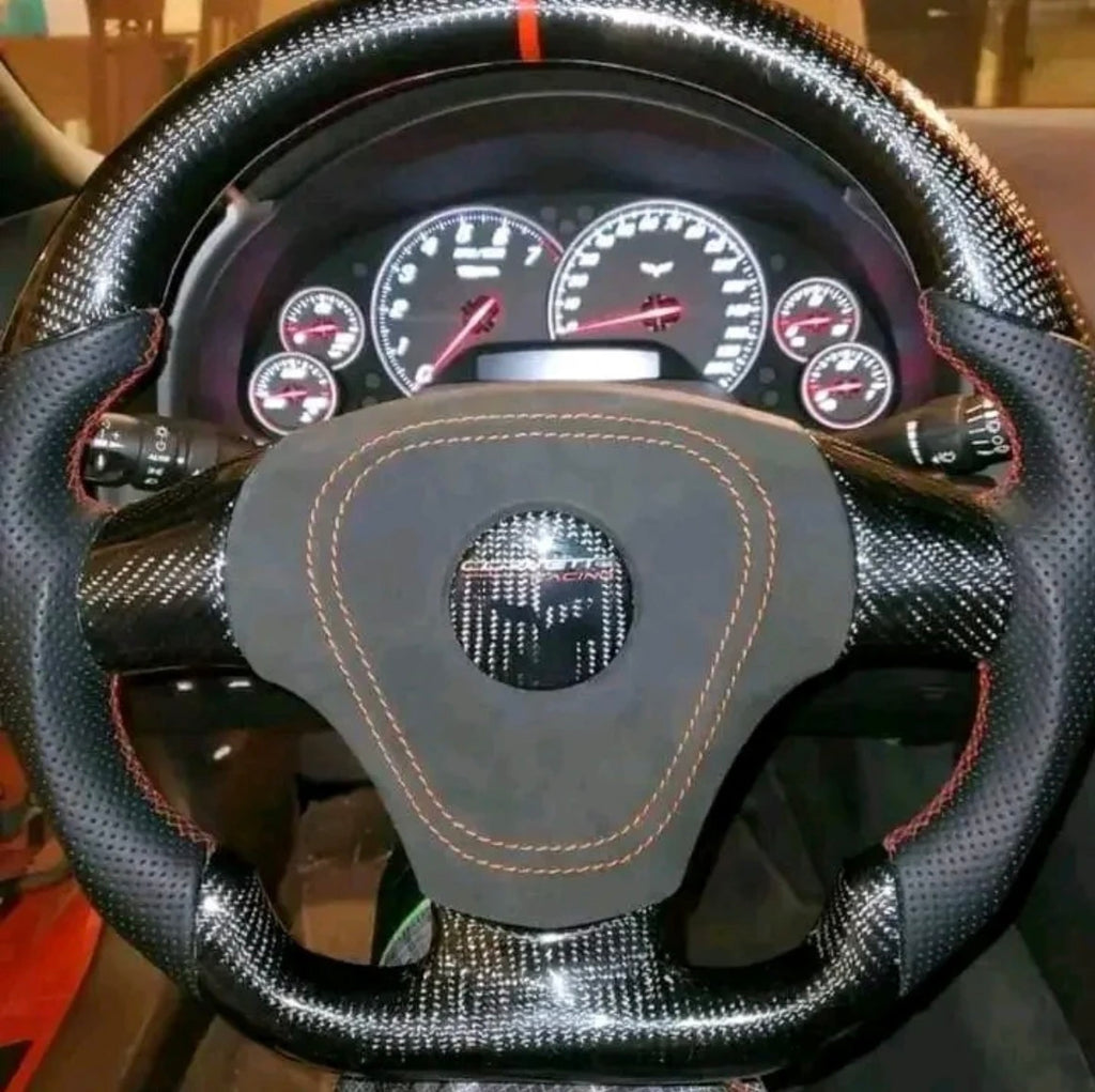 C6 carbon fiber steering wheel with Alcantara airbag cover.