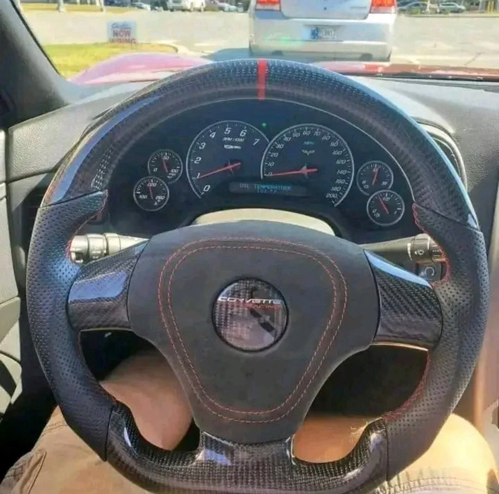 C6 carbon fiber steering wheel with Alcantara airbag cover.