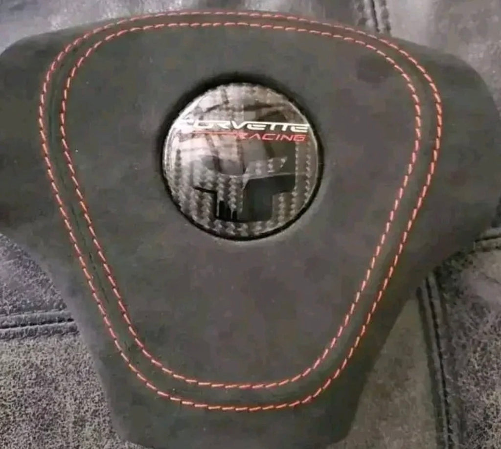 C6 carbon fiber steering wheel with Alcantara airbag cover.