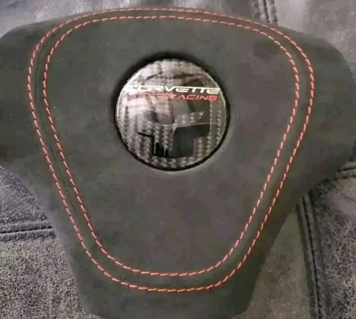 C6 carbon fiber steering wheel with Alcantara airbag cover.